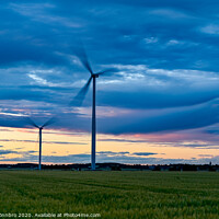 Buy canvas prints of big windmills on field with dramatic sky by Jonas Rönnbro