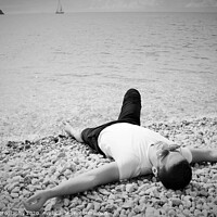 Buy canvas prints of A person lying on a beach by M. J. Photography