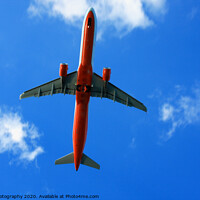 Buy canvas prints of Passenger red airplane in the clouds and blue sky. by M. J. Photography