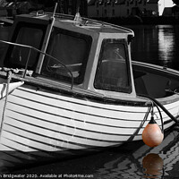 Buy canvas prints of Fishing boat in harbour by Christian Bridgwater