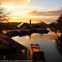 Buy canvas prints of Barges at sunrise at Norbury Junction on the Shropshire Union Canal in Staffordshire, England, UK by Christian Bridgwater