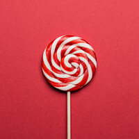 Buy canvas prints of Lollypop on red background. by Boris Zhitkov
