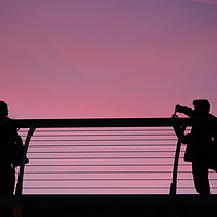 Buy canvas prints of Millennium Bridge London sunset silhouettes by Rehanna Neky