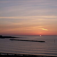 Buy canvas prints of Sunrise in the bay at Newbiggin-by-the-Sea by Richard Dixon
