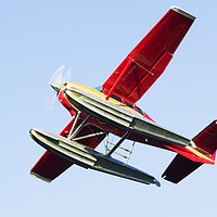 Buy canvas prints of Float plane red. by Ashley Cooper