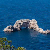 Buy canvas prints of Sa Foradada rock on the blue water of Ibiza Island by Cristian Matei