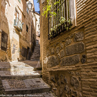 Buy canvas prints of Medieval cobbled and stepped street in the city of Toledo. Spain by Mario Koufios