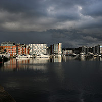 Buy canvas prints of Ipswich waterfront marina with storm clouds by John Biglin