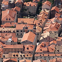 Buy canvas prints of Looking down on Dubrovnik Old town roofs by Andrew Reece