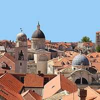 Buy canvas prints of Rooftops of Dubrobnik Old Town showing churches an by Andrew Reece