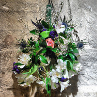 Buy canvas prints of Flowers on a Church Wall by Karen Martin