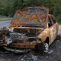Buy canvas prints of BURNT OUT CAR AT THE ROADSIDE by Ray Bacon LRPS CPAGB