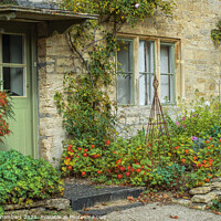 Buy canvas prints of Autumn Cottage Bibury by Alison Chambers