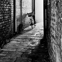 Buy canvas prints of Cycle in the Alley by David Mather