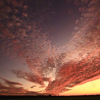 Buy canvas prints of Dramatic  sunrise clouds by Simon Johnson