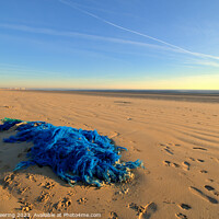 Buy canvas prints of Discarded Fishing Net On Beach by Robert Deering