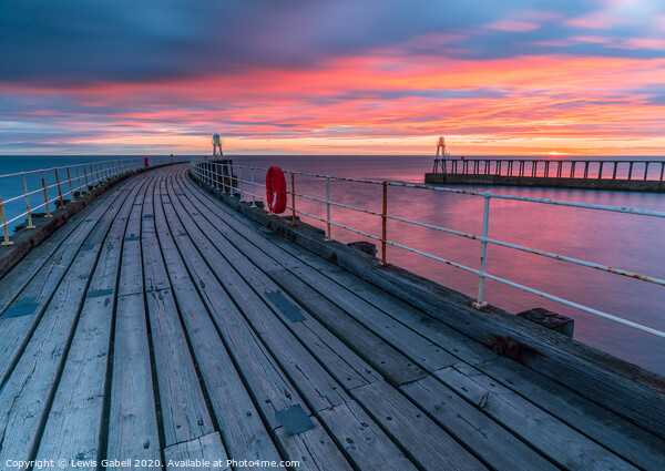 Fiery Sunrise at Whitby Pier, Yorkshire, UK Picture Board by Lewis Gabell