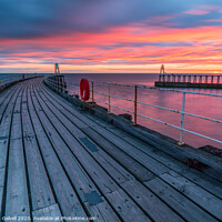 Buy canvas prints of Fiery Sunrise at Whitby Pier, Yorkshire, UK by Lewis Gabell