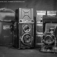 Buy canvas prints of Two antique cameras  by Aimie Burley