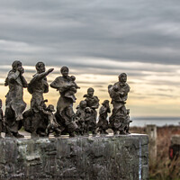 Buy canvas prints of A memorial of families looking out to sea for lost by Liam Thompson