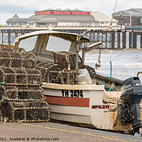 Buy canvas prints of Crab pots and fishing boat on Cromer beach by Chris Yaxley