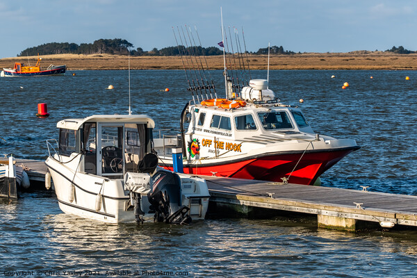 Boats moored in Wells estuary. North Norfolk Picture Board by Chris Yaxley