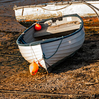 Buy canvas prints of Beached boats in Wells-Next-The-Sea estuary by Chris Yaxley