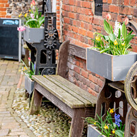 Buy canvas prints of Wooden bench outside the Adam & Eve Pub, Norwich by Chris Yaxley