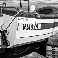 Buy canvas prints of Close up of a fishing boat on Cromer beach in black and white by Chris Yaxley