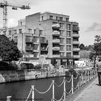 Buy canvas prints of Flats under construction on the bank of the River Wensum, Norwich by Chris Yaxley
