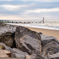 Buy canvas prints of View across Cart Gap beach on the North Norfolk coast. Captured during early evening by Chris Yaxley