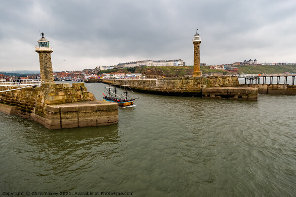 Boat leaving Whitby Harbour, North Yorkshire Picture Board by Chris Yaxley