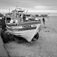 Buy canvas prints of Traditional fishing boat on Cromer beach in black and white by Chris Yaxley