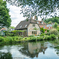 Buy canvas prints of Quaint riverside cottage on the bank of the River Test, Hampshire by Chris Yaxley