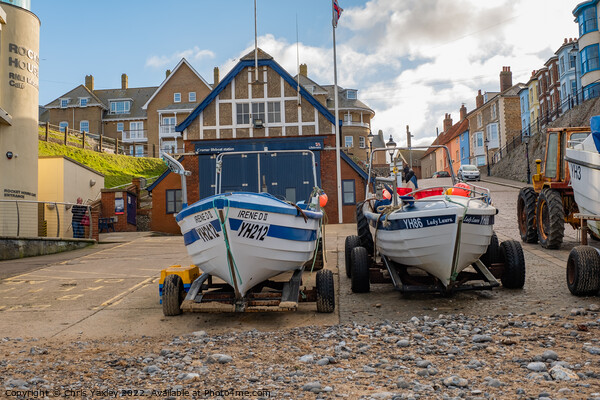 Fishing in the seaside town of Cromer on the North Norfolk coast Picture Board by Chris Yaxley