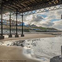 Buy canvas prints of Cromer seafront from under the pier by Chris Yaxley