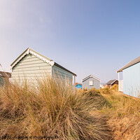 Buy canvas prints of Norfolk beach huts by Chris Yaxley