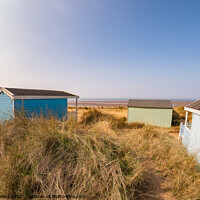 Buy canvas prints of Coastal beach huts in Hunstanton, Norfolk coast by Chris Yaxley