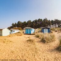 Buy canvas prints of Ultra wide shot of Hunstanton beach huts by Chris Yaxley