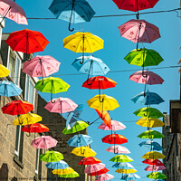 Buy canvas prints of Colourful umbrellas in Aberdeen by Chris Yaxley