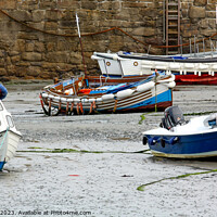 Buy canvas prints of Fishing boats in Padstow Harbour at low tide by Chris Yaxley