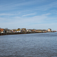 Buy canvas prints of View down the River Yare towards the seaside towns of Great Yarmouth on the East and Gorleston on the West. Captured on a bright and sunny day by Chris Yaxley