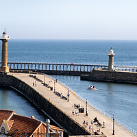 Buy canvas prints of The Piers in Whitby harbour by Chris Yaxley