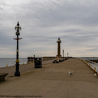 Buy canvas prints of The east pier in the seaside town of Whitby on the by Chris Yaxley