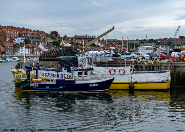 Fishing boats in Whitby harbour Picture Board by Chris Yaxley