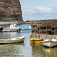 Buy canvas prints of Fishing boats in Staithes Harbour by Chris Yaxley