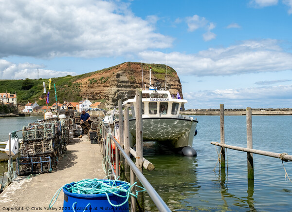 Fishing boat in Staithes harbour Picture Board by Chris Yaxley