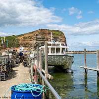 Buy canvas prints of Fishing boat in Staithes harbour by Chris Yaxley
