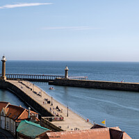 Buy canvas prints of Whitby East and West Piers by Chris Yaxley