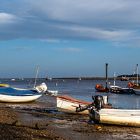 Buy canvas prints of Boats beached in Wells-next-the-sea Harbour by Chris Yaxley